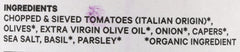 Seggiano puttanesca sauce ingredients close-up showing olives and capers contributing bold flavor.