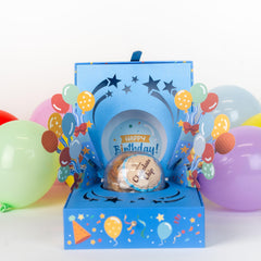 Send A Cake Bloom Box colorful balloons heighten the celebratory mood.