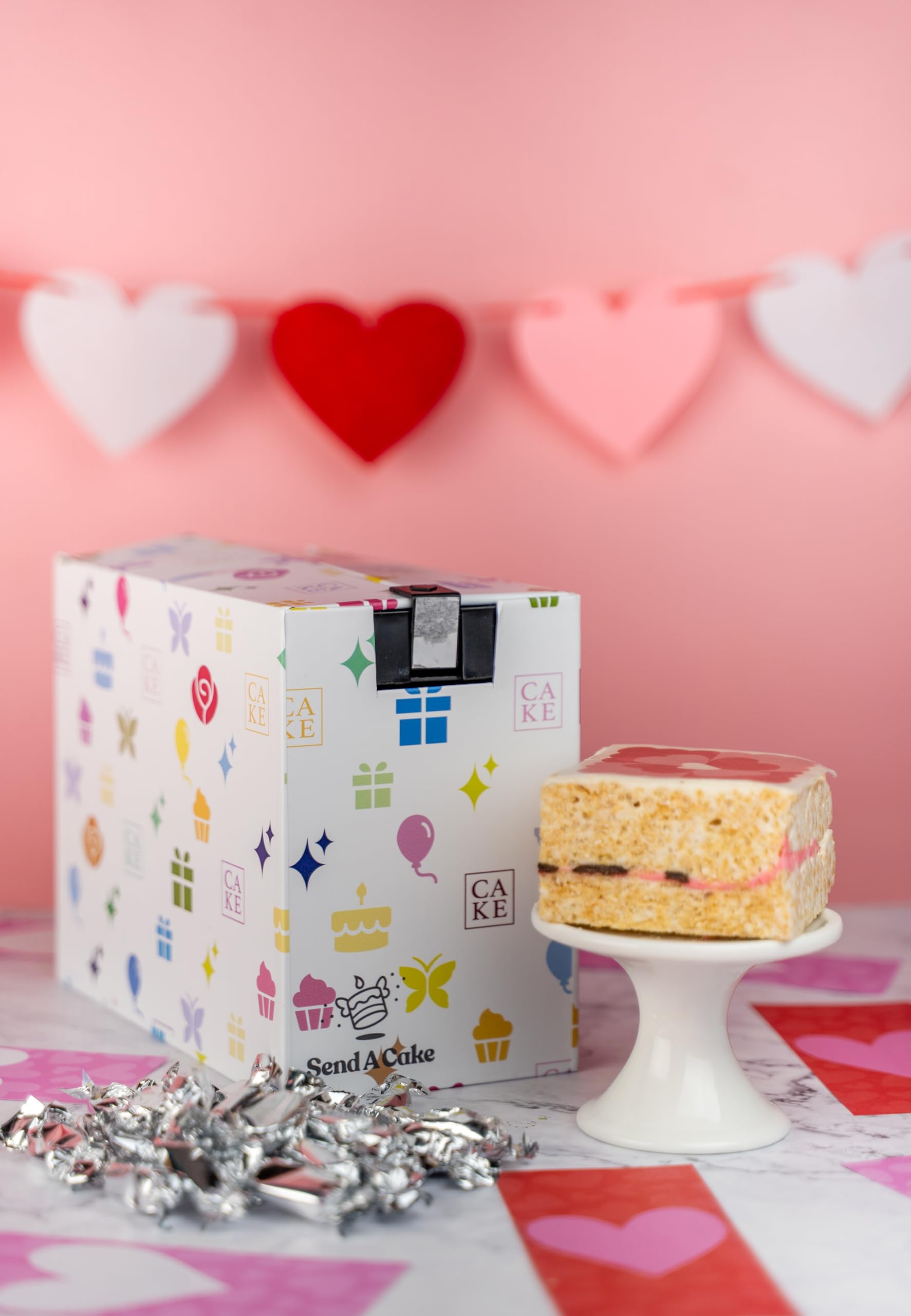 Send A Cake Raspberry Chocolate Crispy Treat slice reveals tart raspberry and marshmallow core.
