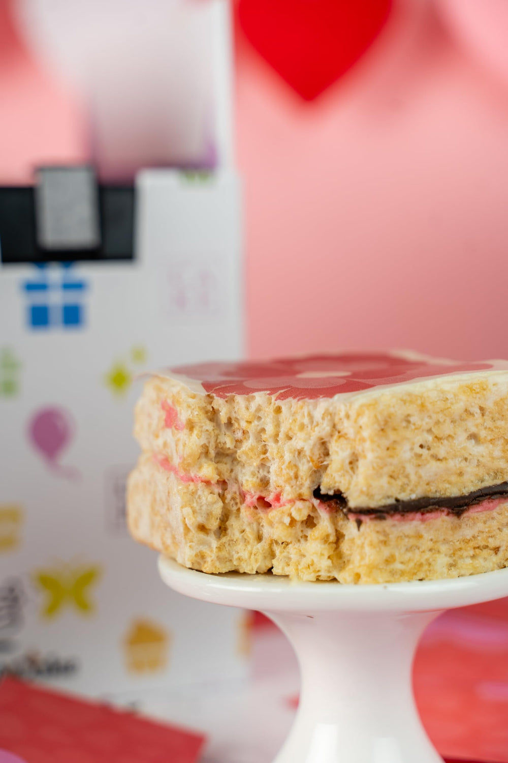 Send A Cake Roses & Charms heart confetti bursts for a festive surprise.