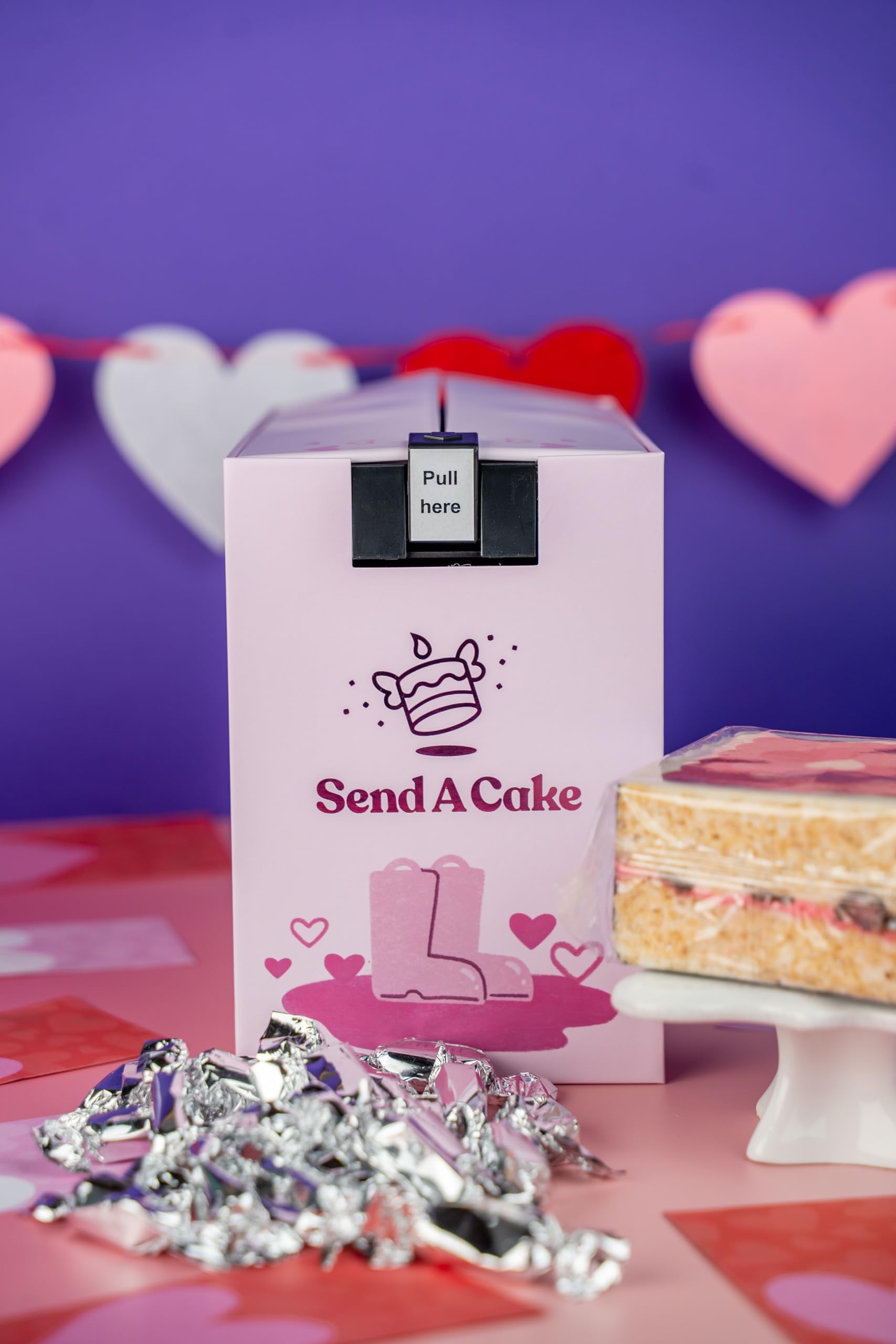 Send A Cake box lid opens to upbeat music surprise.