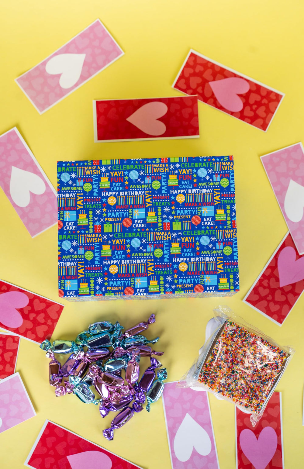 Foil-wrapped caramels in pink, blue, and purple from Send A Cake.