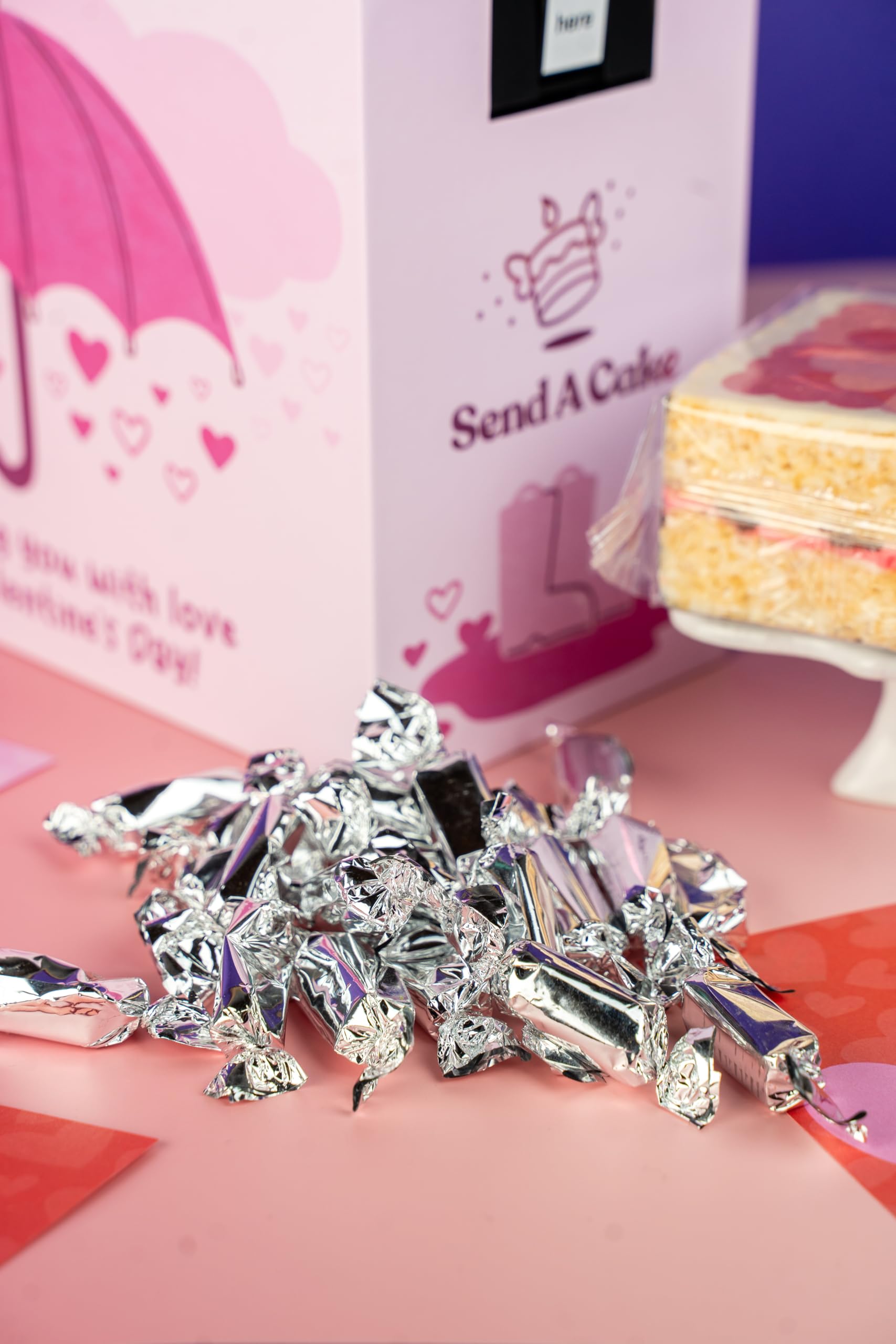 Send A Cake rainbow sprinkle crispy cake with raspberry center.