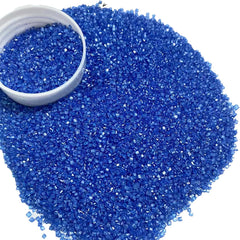 Vivid royal blue sugar crystals shimmering on a dessert surface