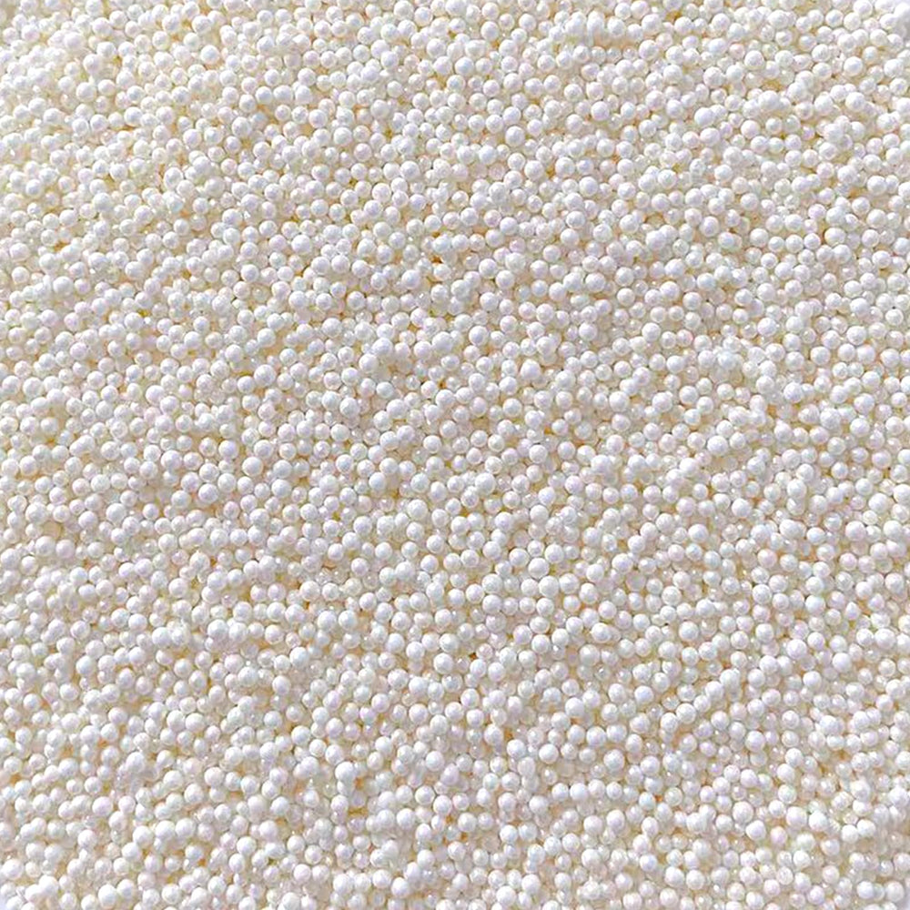 Sentovac white nonpareils sprinkles decorate cakes with delicate, celebratory flair