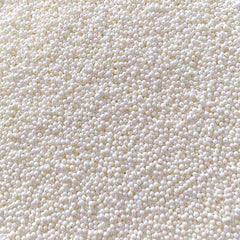 Sentovac white nonpareils sprinkles decorate cakes with delicate, celebratory flair