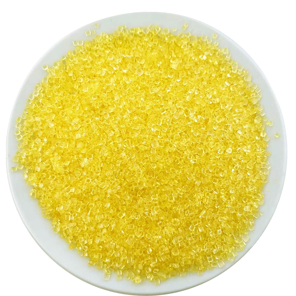 Sentovac yellow sanding sugar atop a cupcake for bright sparkle.