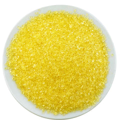 Sentovac yellow sanding sugar atop a cupcake for bright sparkle.