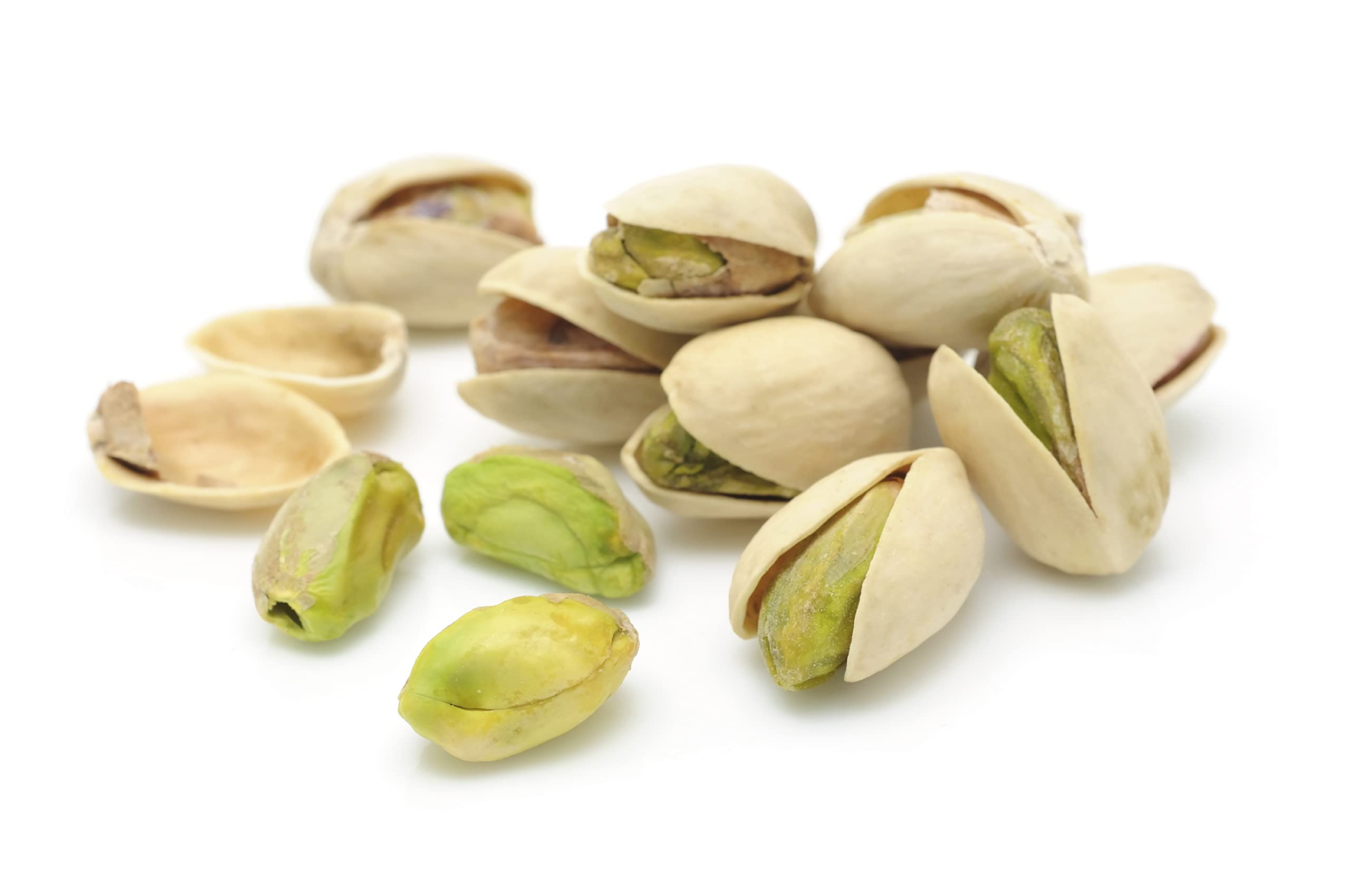 Pistachios being poured into a bowl for gatherings.