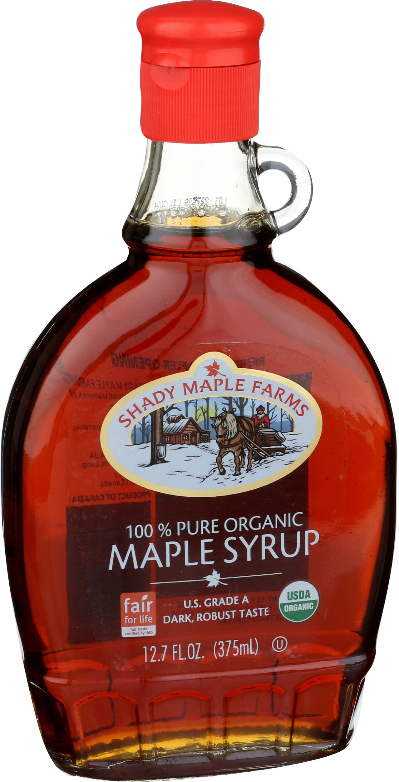 Shady Maple Farm amber colored maple syrup on light backdrop