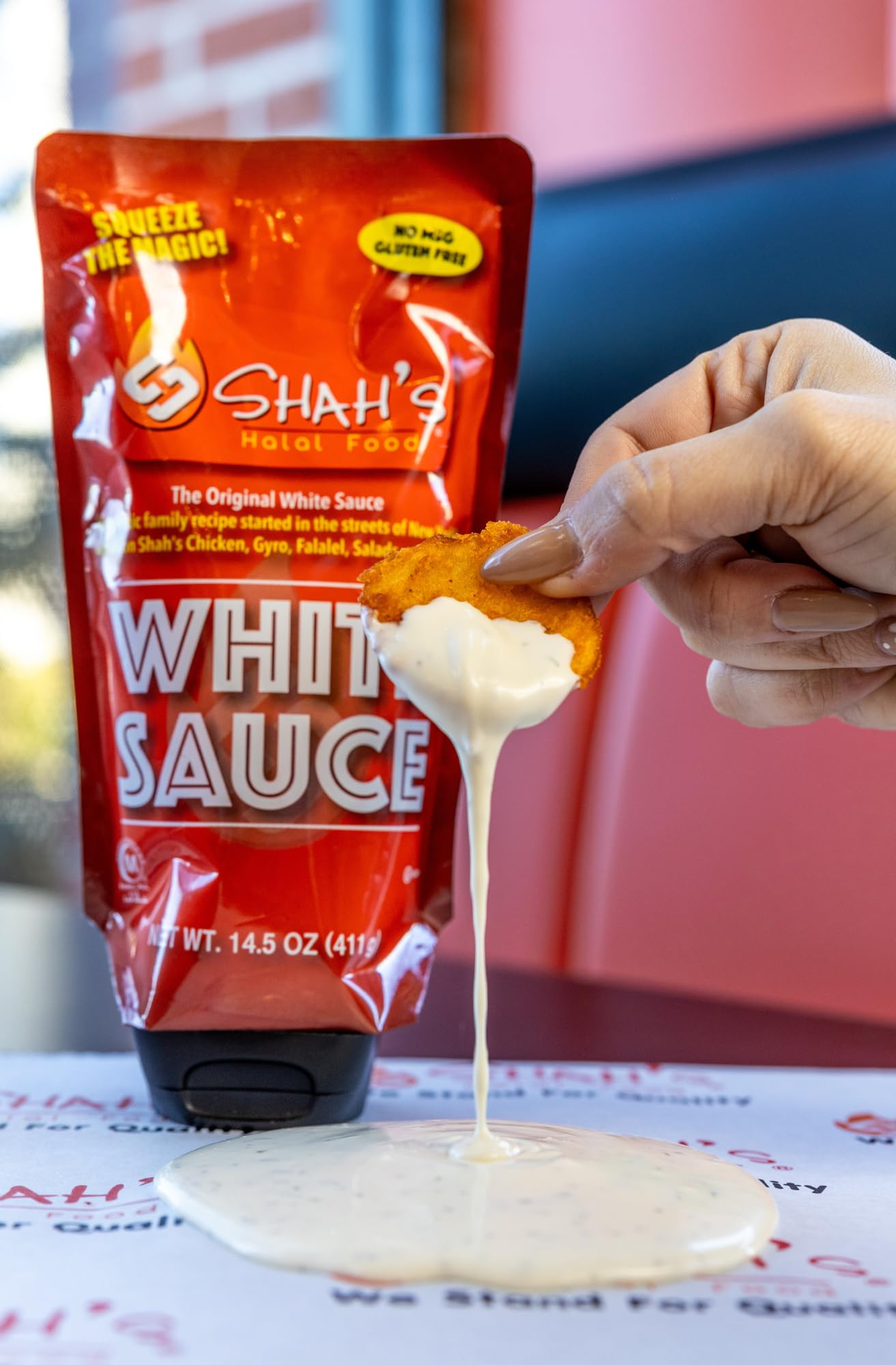 SHAH'S HALAL FOOD White Sauce as a dip for crispy fries, silky and inviting.