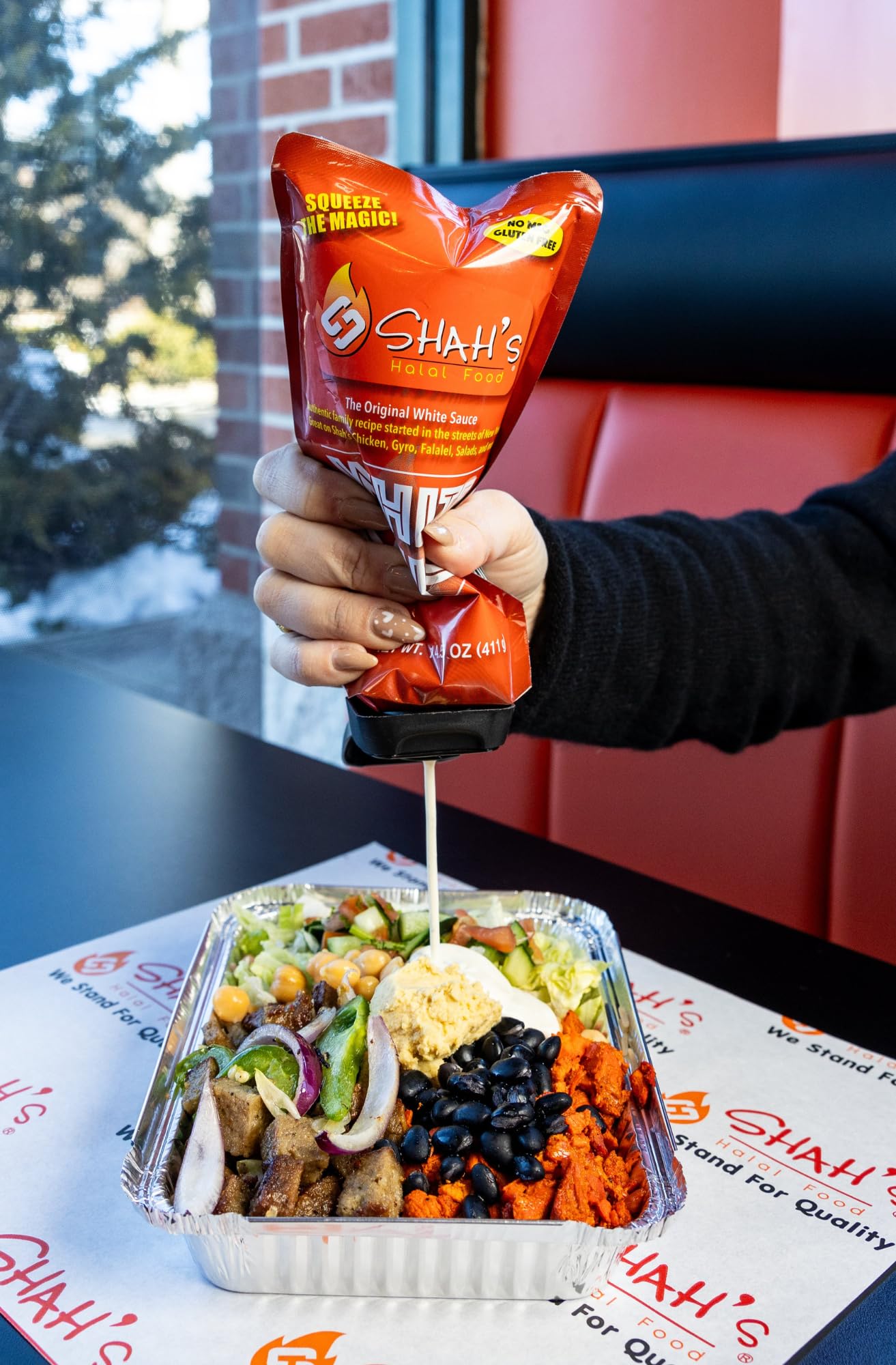 SHAH'S HALAL FOOD White Sauce on wraps and burgers, elevating everyday meals.