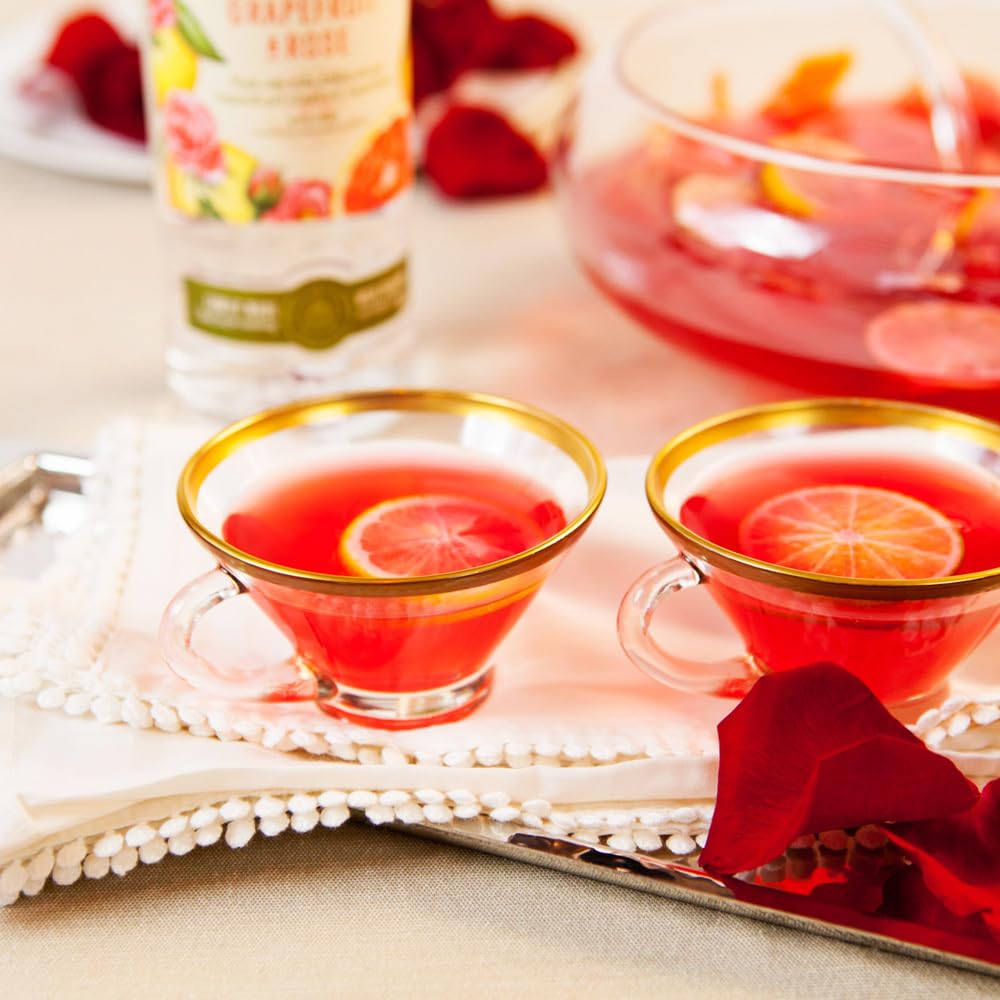 Cocktail kit setup with hibiscus syrup on a bar cart