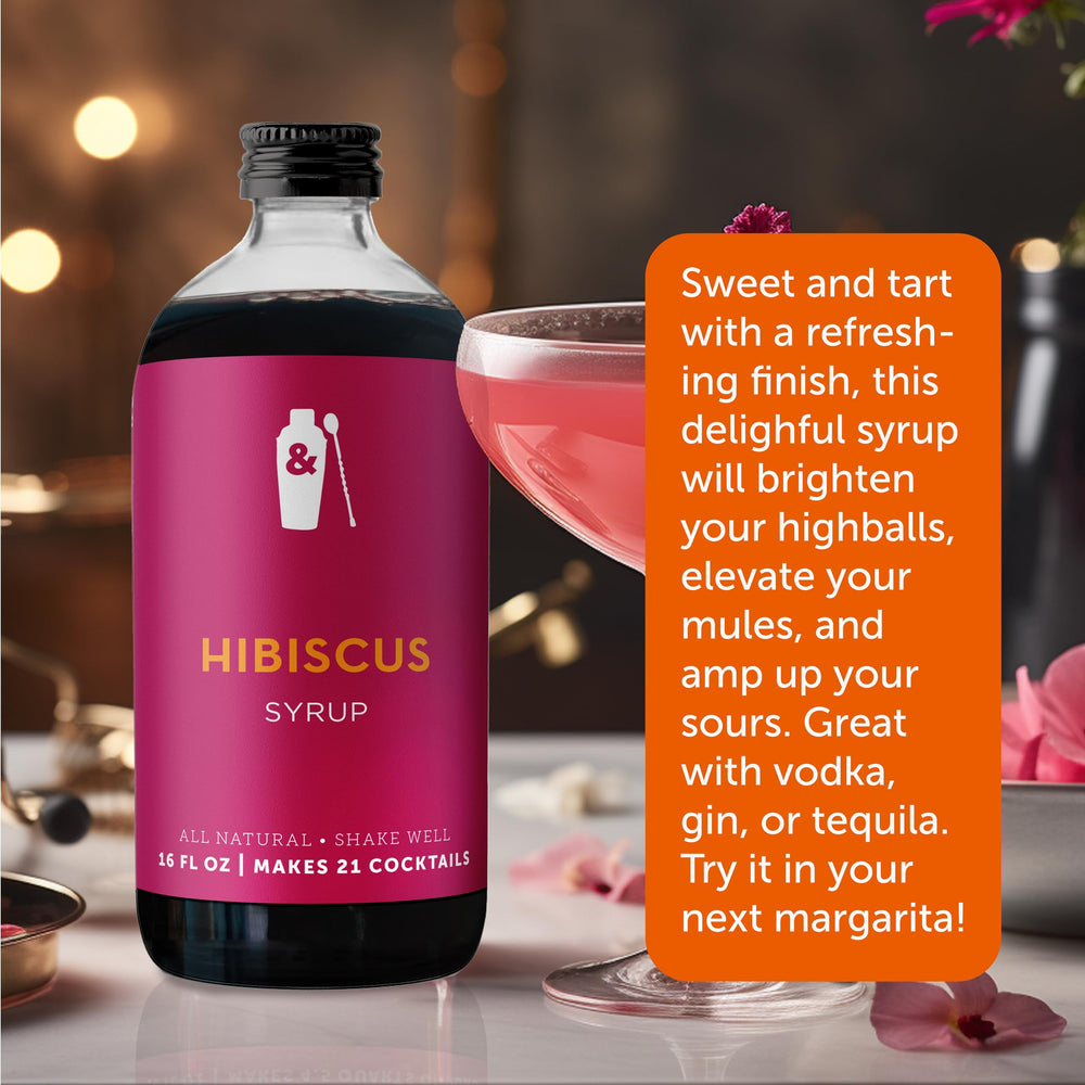 Pouring hibiscus syrup into a glass to brighten mocktails
