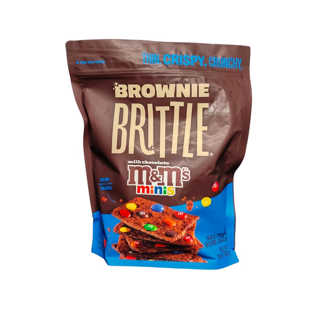 Closeup of Sheila G's Brownie Brittle M&M minis bag showing crisp brownie edge, ideal for parties.
