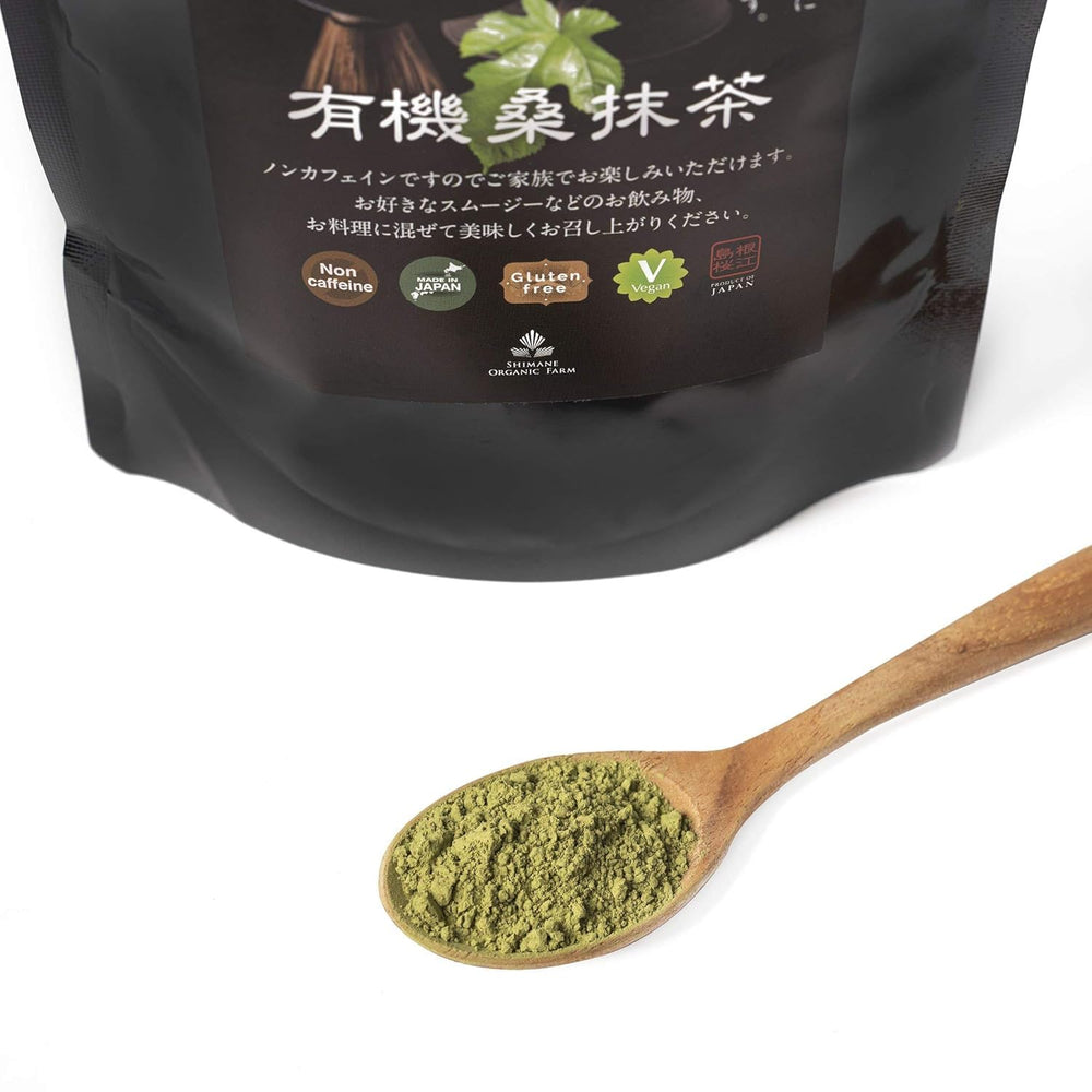 Shimane Organic Farm Mulberry Matcha setup with whisk, showcasing traditional preparation.