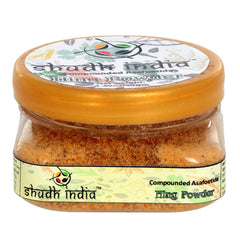 Shudh India Hing powder in a jar for authentic flavor in Indian cooking.