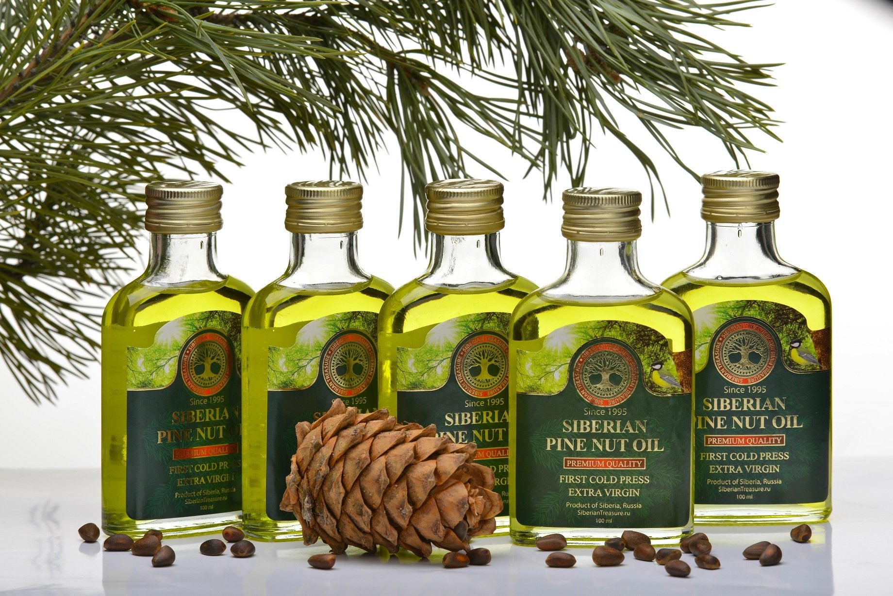 Siberian Treasure pine nut oil in kitchen setting ready to drizzle