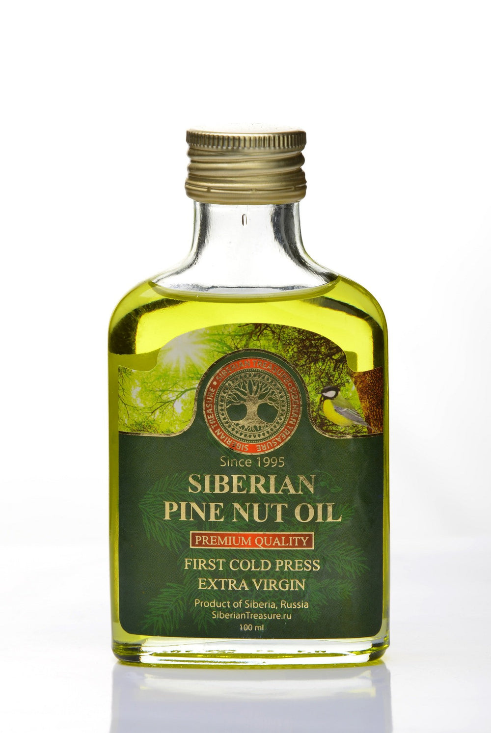 Siberian Treasure pine nut oil being poured for culinary use