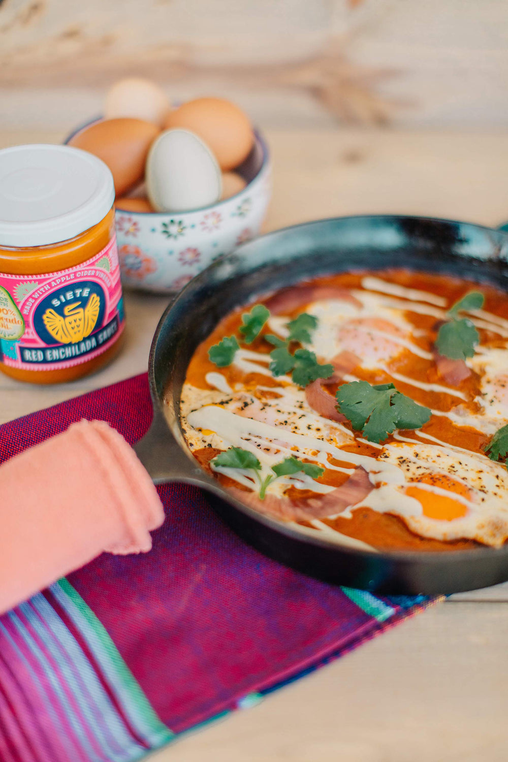 Siete bottle beside avocado oil-based sauce and simple ingredients.