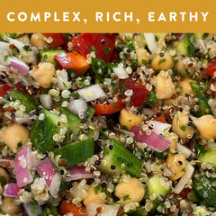 Close-up of white red and black quinoa reveals earthy, nutty texture.