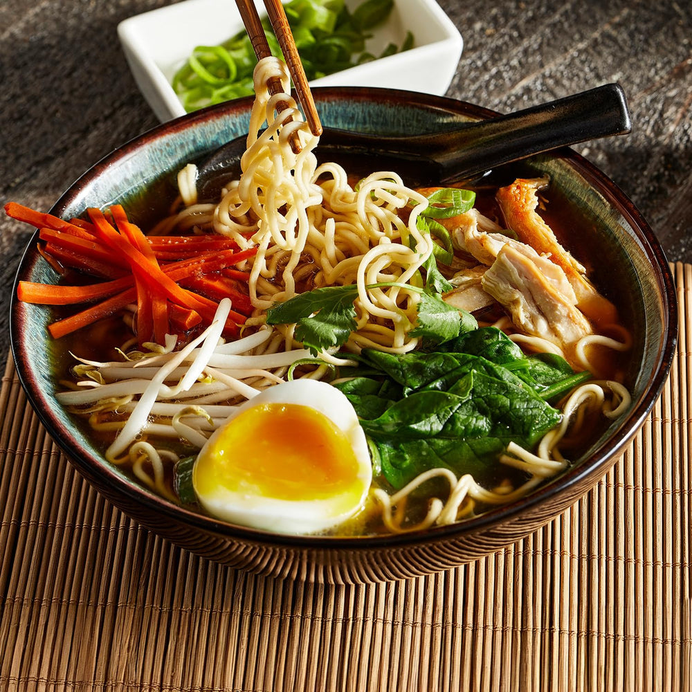 Simply Asia broth close-up bottle suggests rich flavor ready to cook.