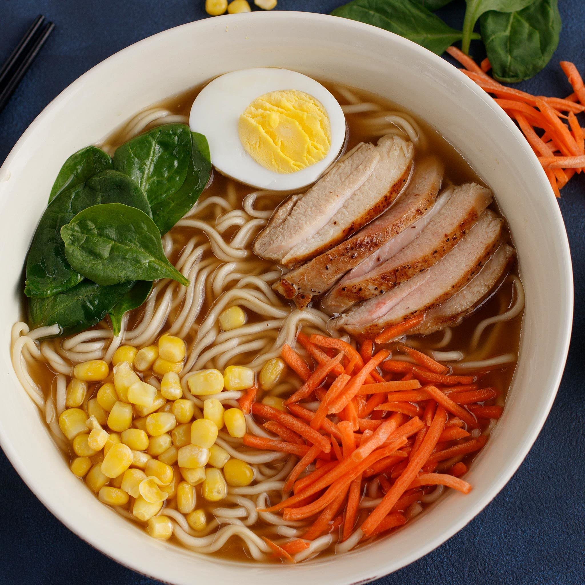 Simply Asia broth simmer on stove signals versatile base for soups and sautés.