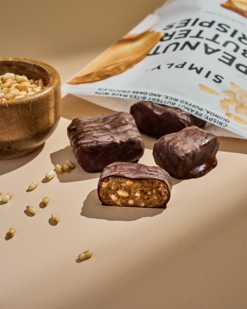 Simply Candy Bars Peanut Butter Crispies packaging emphasizes vegan, non-GMO credentials.