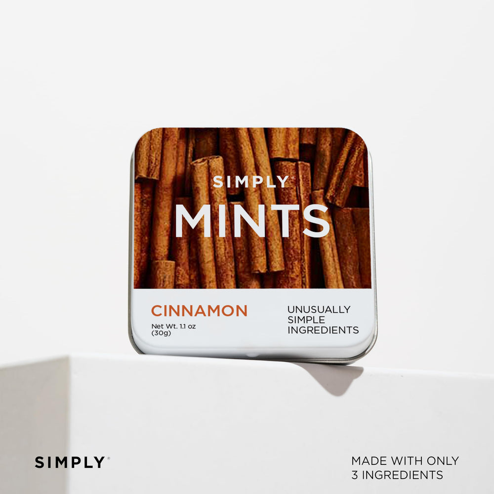 Holding a mint from Simply Gum for a mid-meal refresh