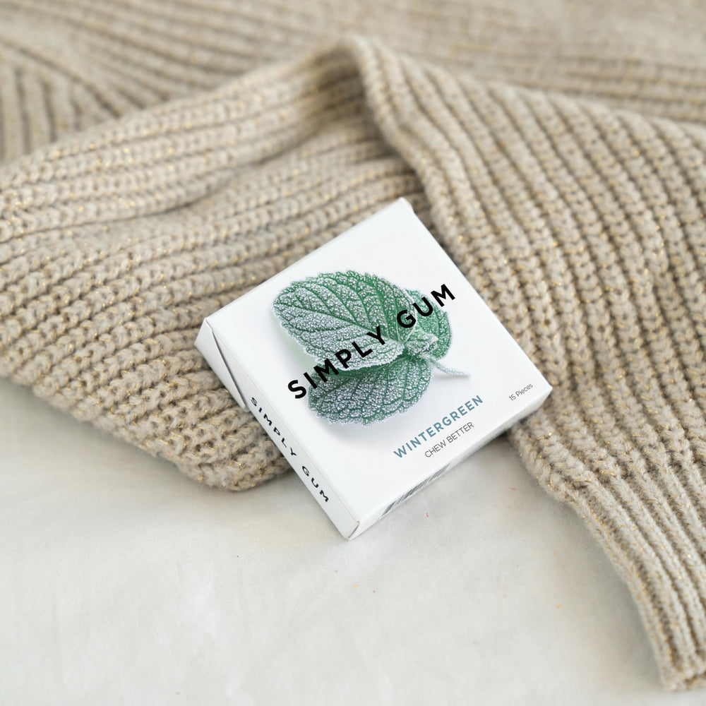 SIMPLY Gum Wintergreen in-use pocket pack for fresh breath on the go.