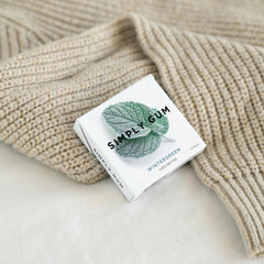 SIMPLY Gum Wintergreen in-use pocket pack for fresh breath on the go.