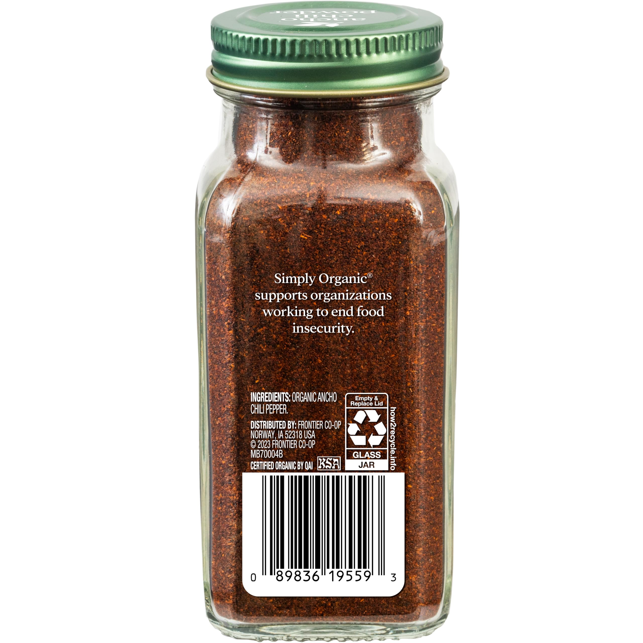 Close-up of ancho chili powder texture showing deep red-brown color and aroma