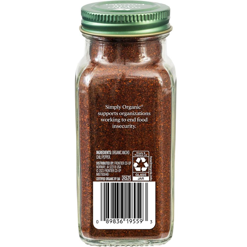 Close-up of ancho chili powder texture showing deep red-brown color and aroma