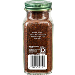 Close-up of ancho chili powder texture showing deep red-brown color and aroma