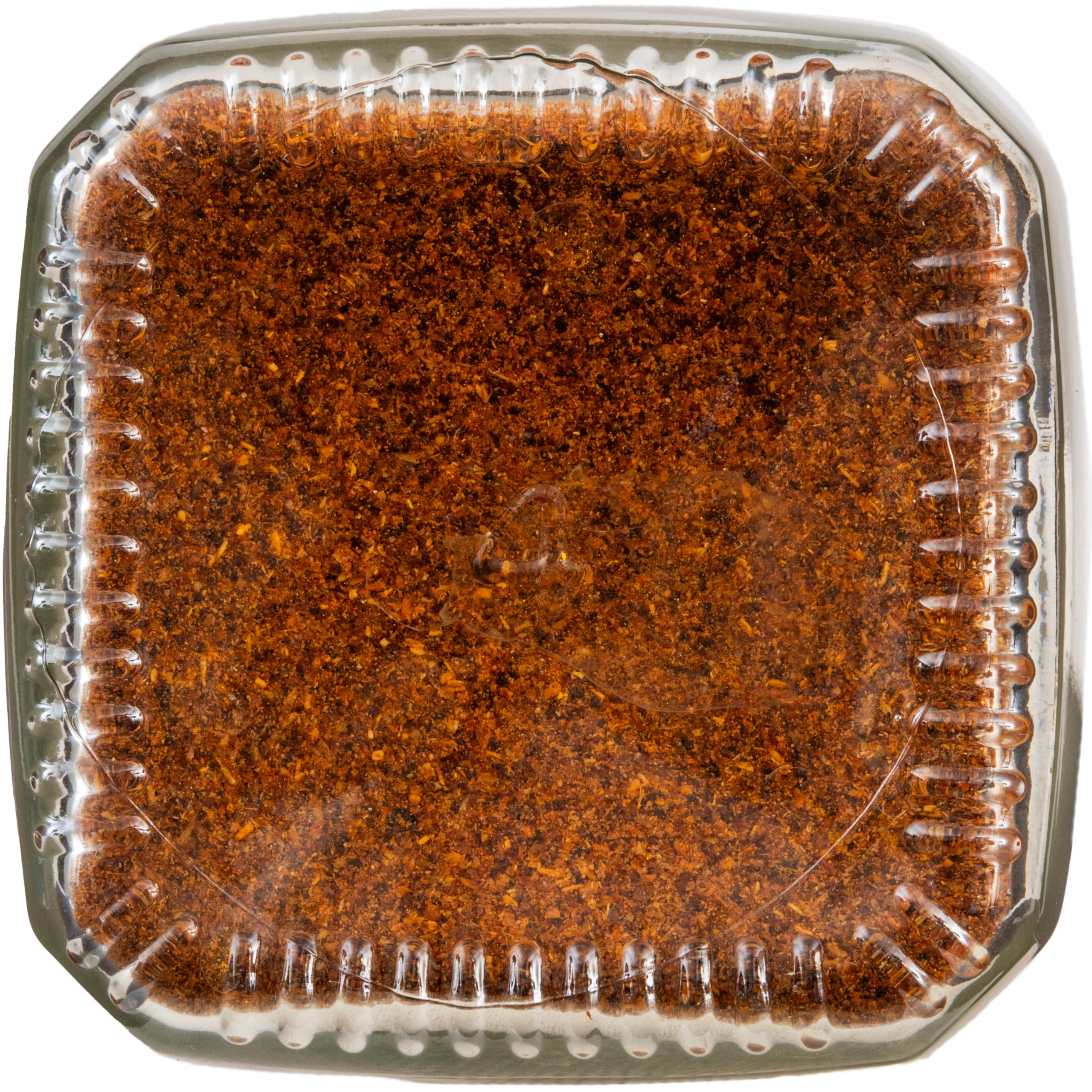 Simply Organic chili powder glass bottle closeup showcasing texture and aroma.