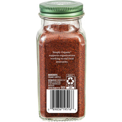Simply Organic Chipotle Powder bottle with spoon ready to season grilled meats
