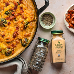 Simply Organic Ground Black Pepper in spice rack signals versatile kitchen staple.