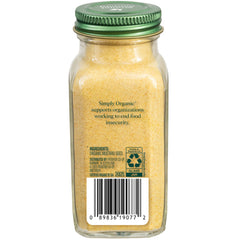 Simply Organic ground mustard seeds spoon close-up emphasizes tangy kick for curries