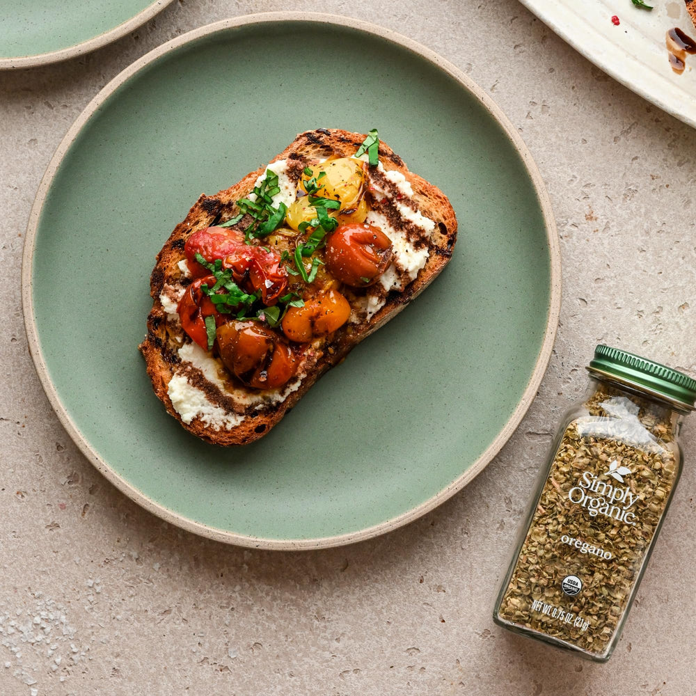 Simply Organic oregano sprinkled over grilled vegetables during roasting