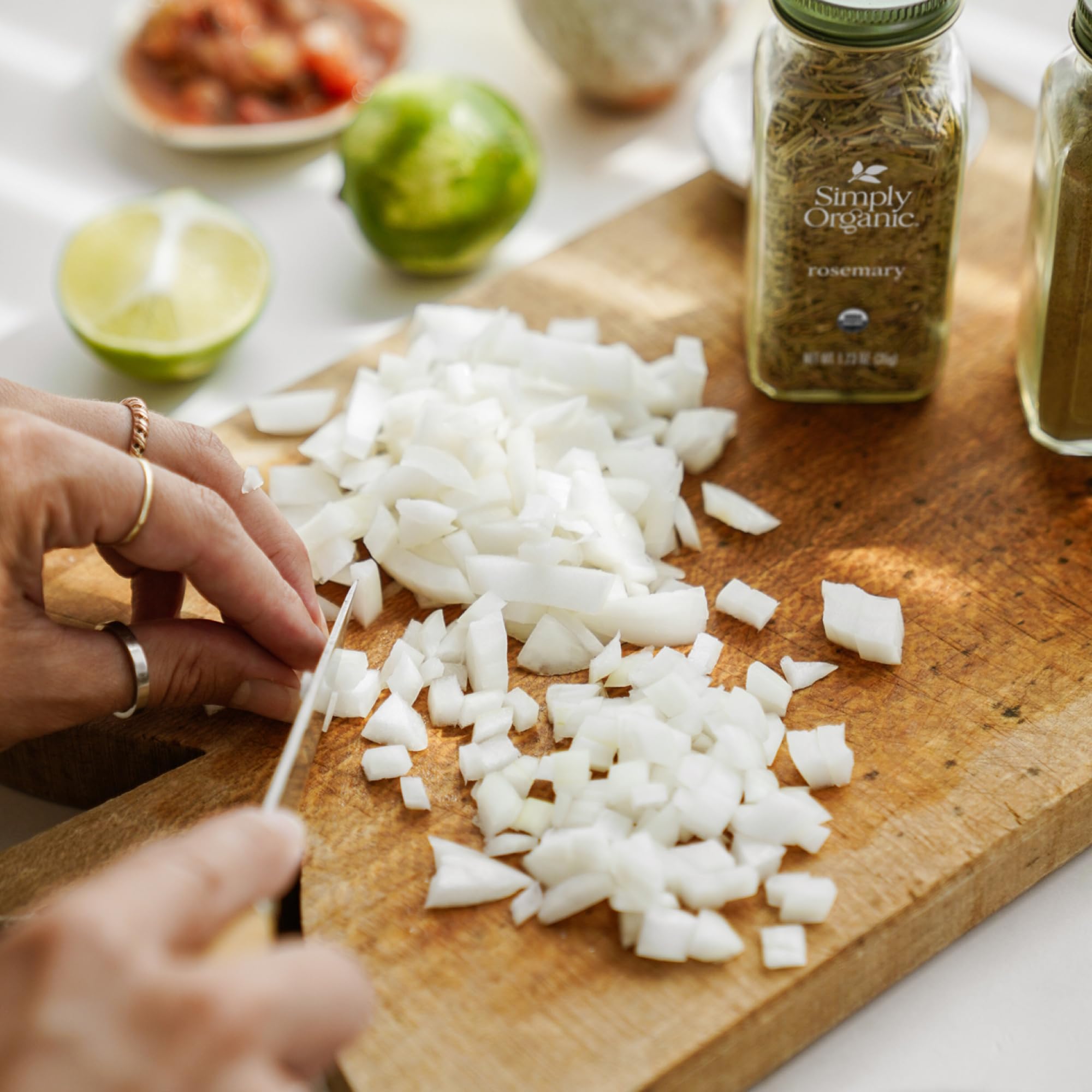 Simply Organic Rosemary Leaf kitchen scene suggesting quick flavor boosts for roasts and sauces.