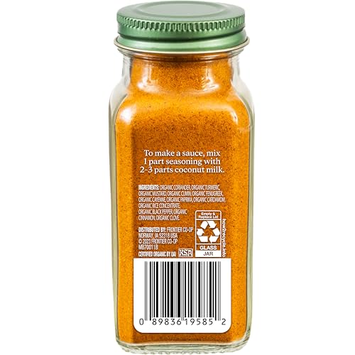 Simply Organic powder shown with a spoon for quick curries and marinades.
