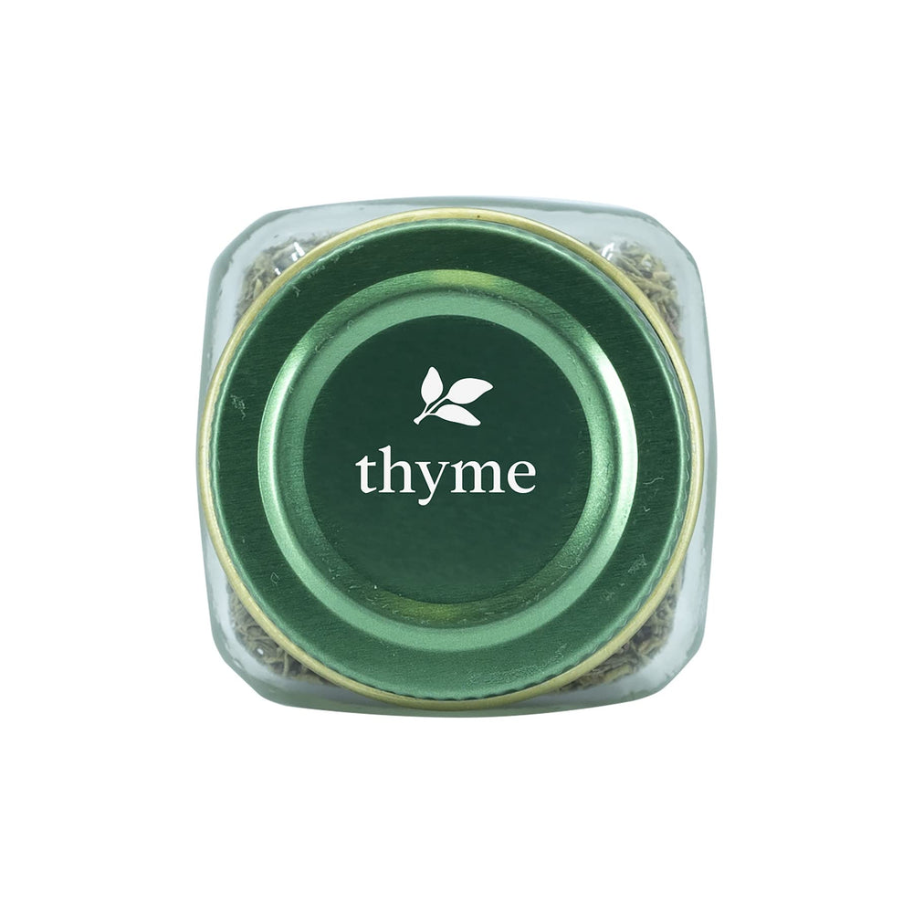 Pouring Simply Organic thyme leaf to enrich stews and sauces.