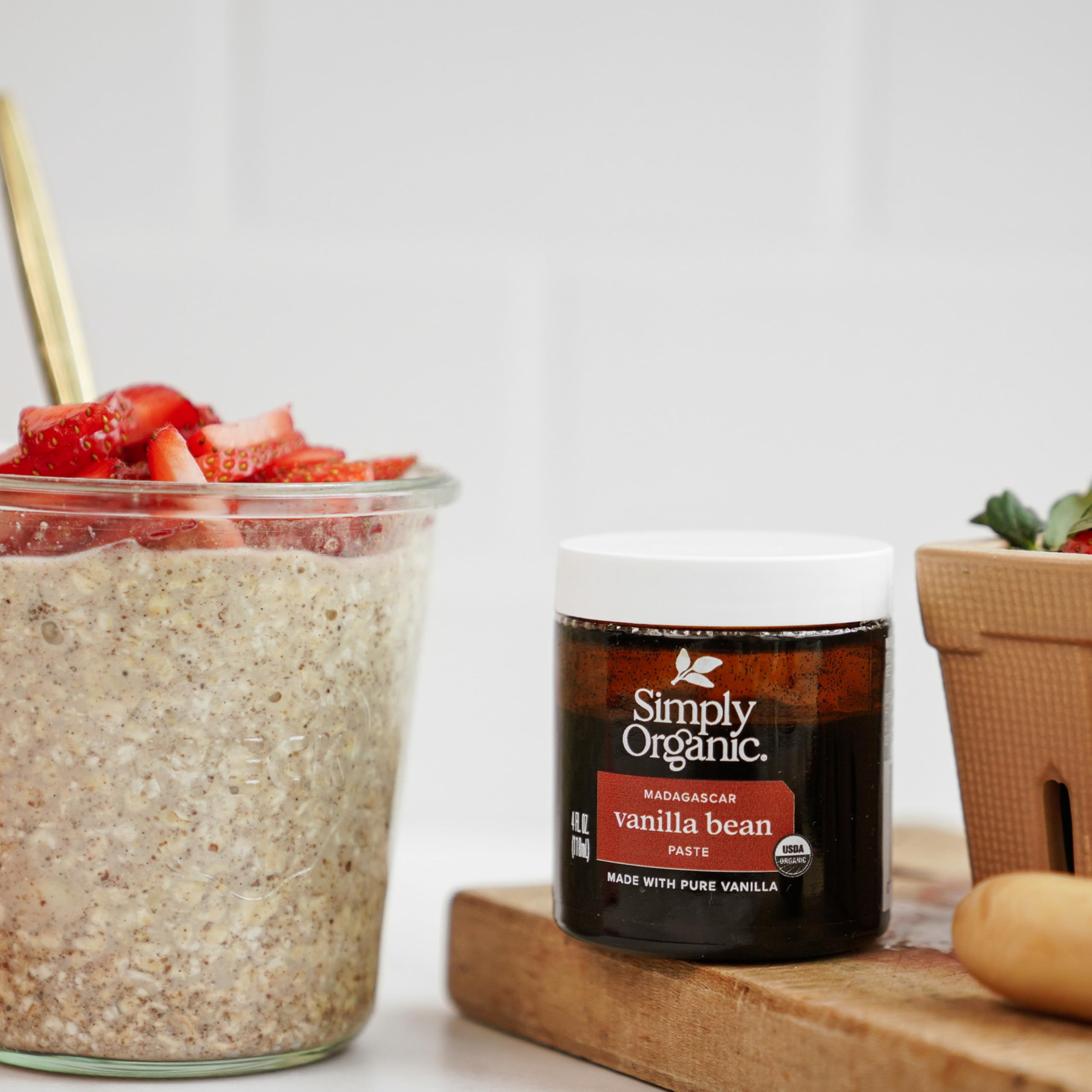 Vanilla bean paste and pods on counter for premium baking with Simply Organic