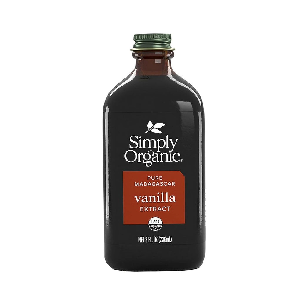 Simply Organic Vanilla Extract bottle pour highlights rich aroma for desserts.