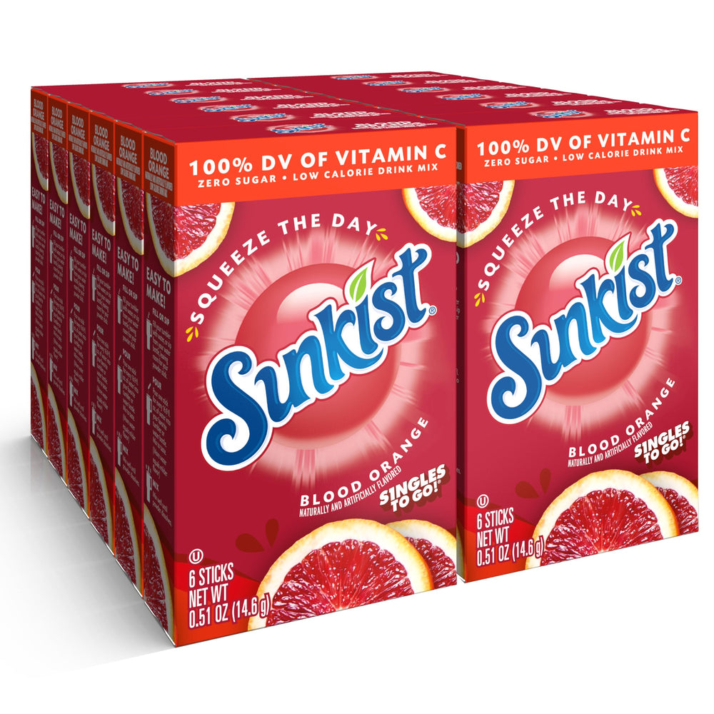 SINGLES TO GO Blood Orange stick next to a glass of water for on-the-go hydration.