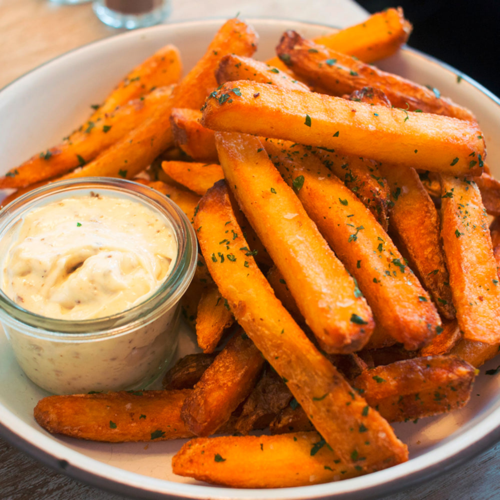 Dollop of Sir Kensington's Truffle Garlic Aioli in a serving bowl