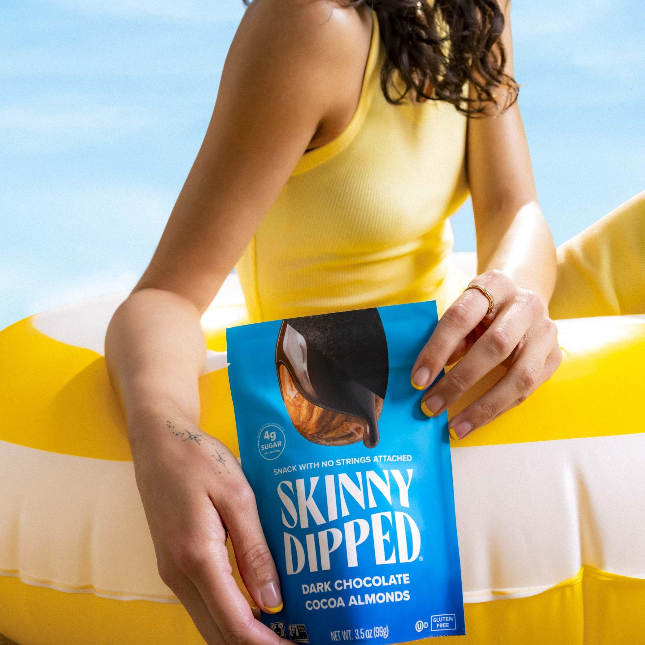 SkinnyDipped gluten-free and non-GMO badges on packaging.
