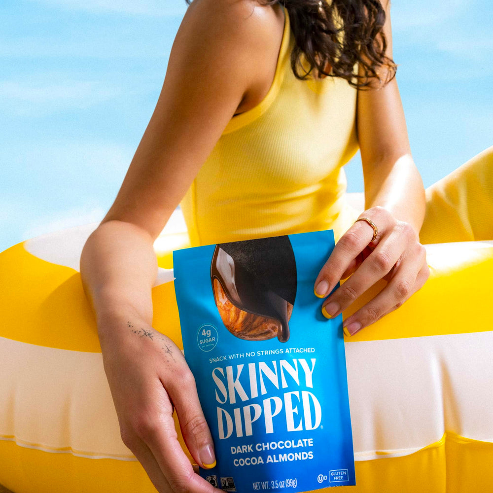 SkinnyDipped gluten-free and non-GMO badges on packaging.