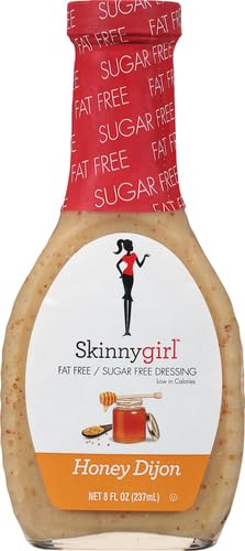 Close-up of Skinnygirl Honey Dijon dressing topping bitter greens.