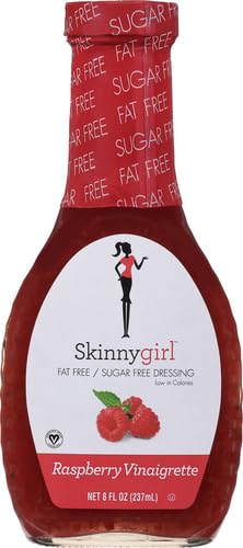 Salad bowl with raspberries featuring Skinnygirl Raspberry Vinaigrette for pairing ideas.